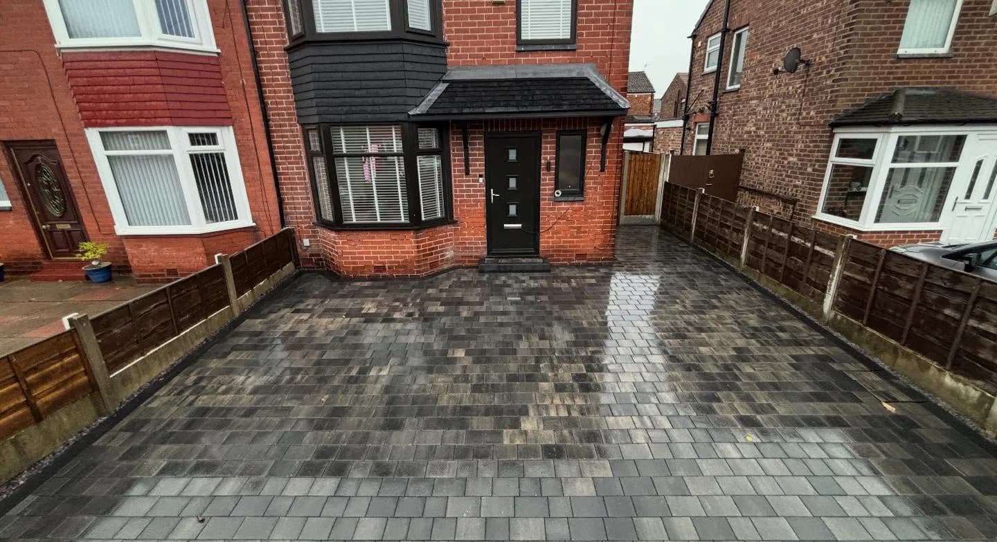Patterned grey block-paved driveway completed by M60