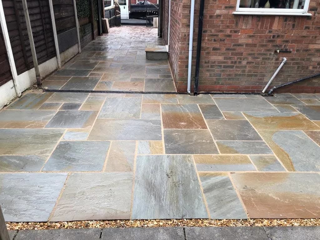 Completed multitone natural stone paving and side path